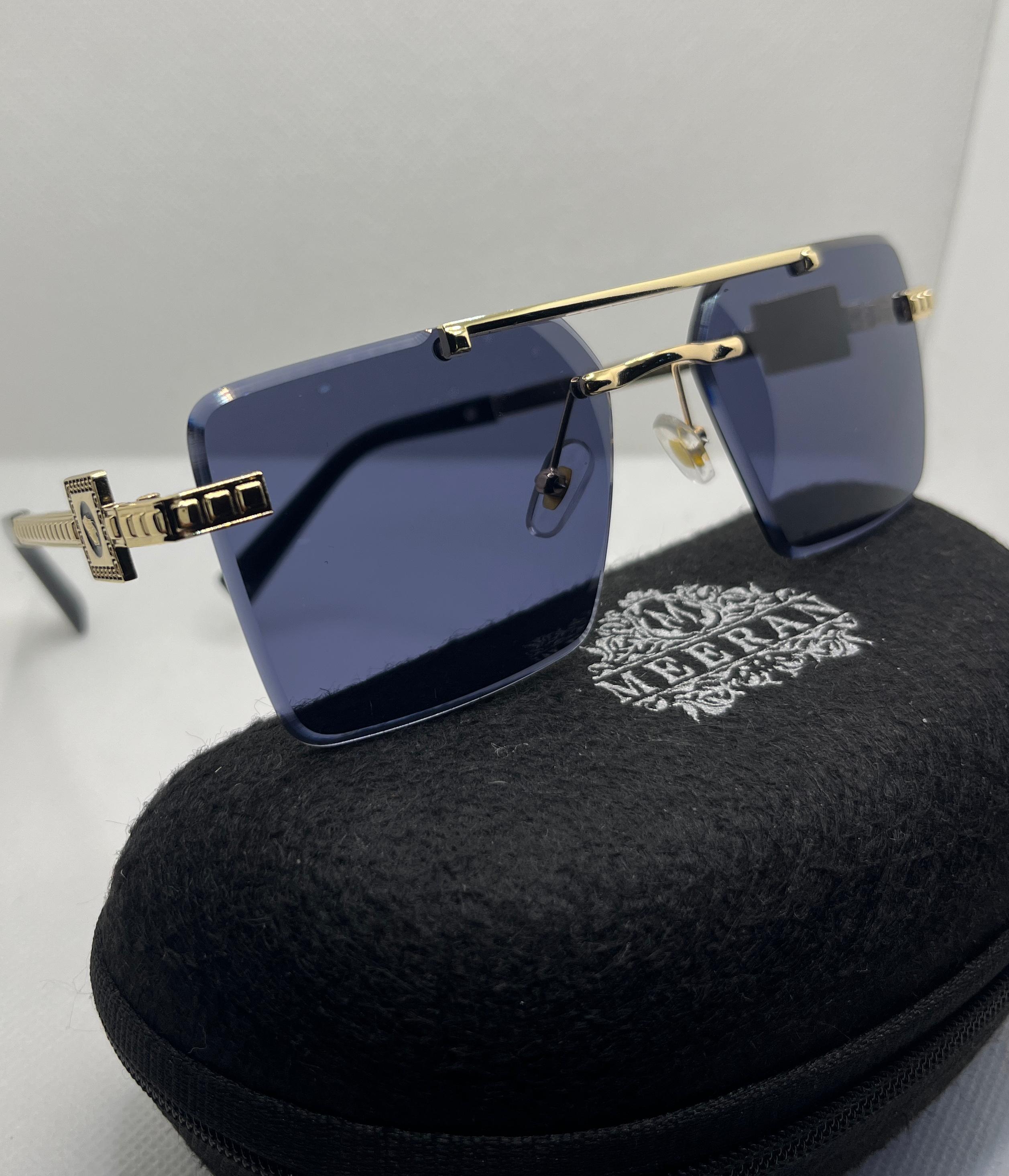 Meeran Royal sunglasses with blue gradient lenses and a Brown/gold frame, featuring UV protection